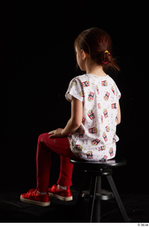 Lilly  1 dressed red leggings red shoes sitting t…